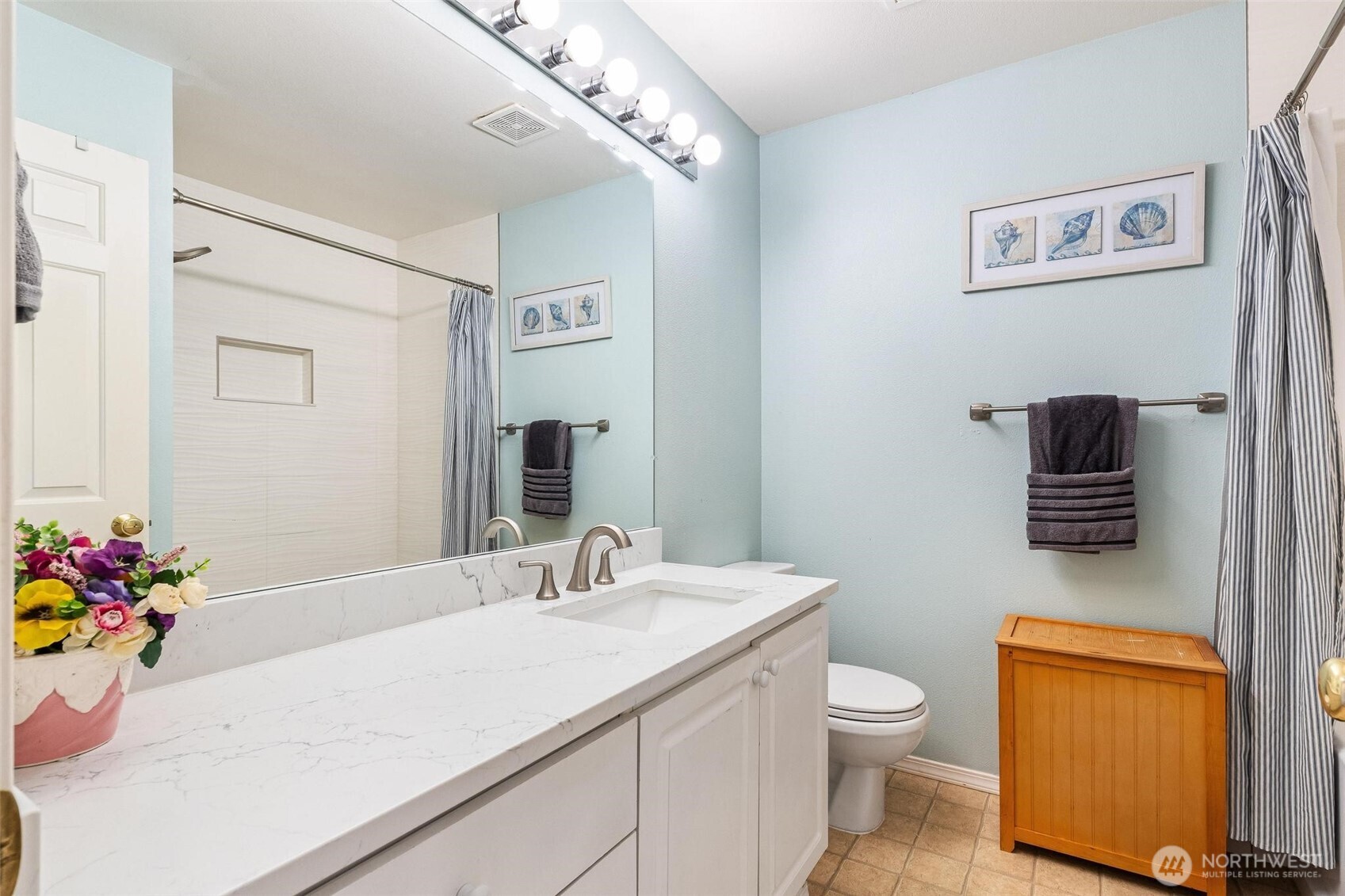 11856 Northeast 162nd Lane, Unit 94 Bothell, WA 98011 - Photo 17 of 36 a bathroom with a toilet sink and mirror