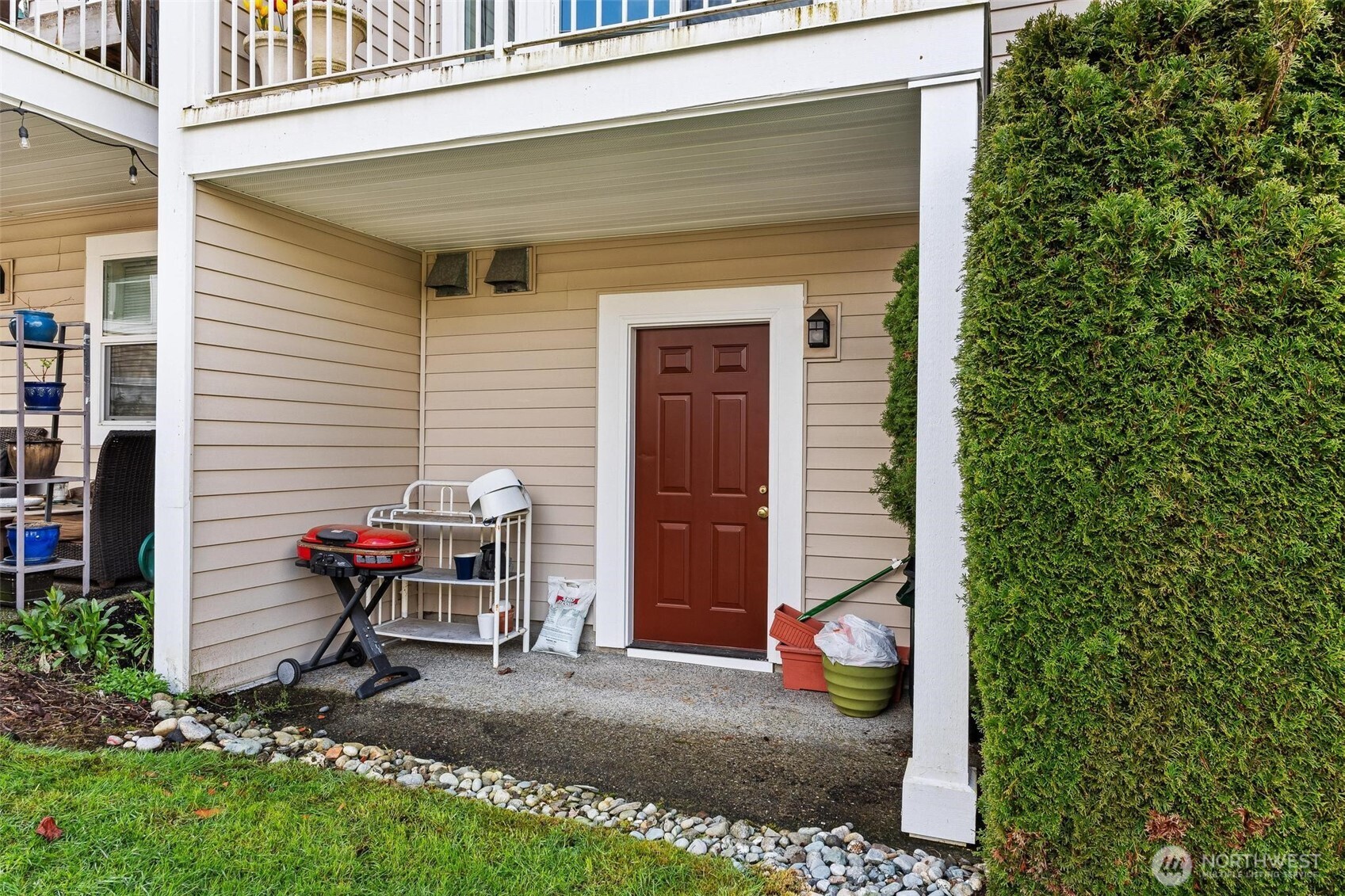11856 Northeast 162nd Lane, Unit 94 Bothell, WA 98011 - Photo 21 of 36 a view of a porch with furniture and next to a yard