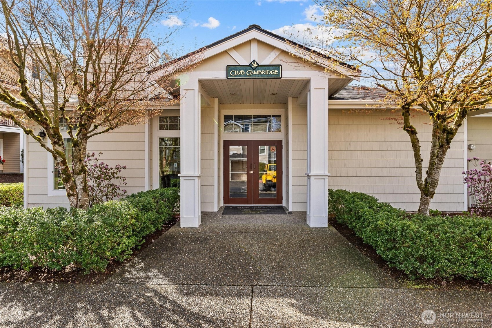11856 Northeast 162nd Lane, Unit 94 Bothell, WA 98011 - Photo 24 of 36 a front view of a house with a yard and garage