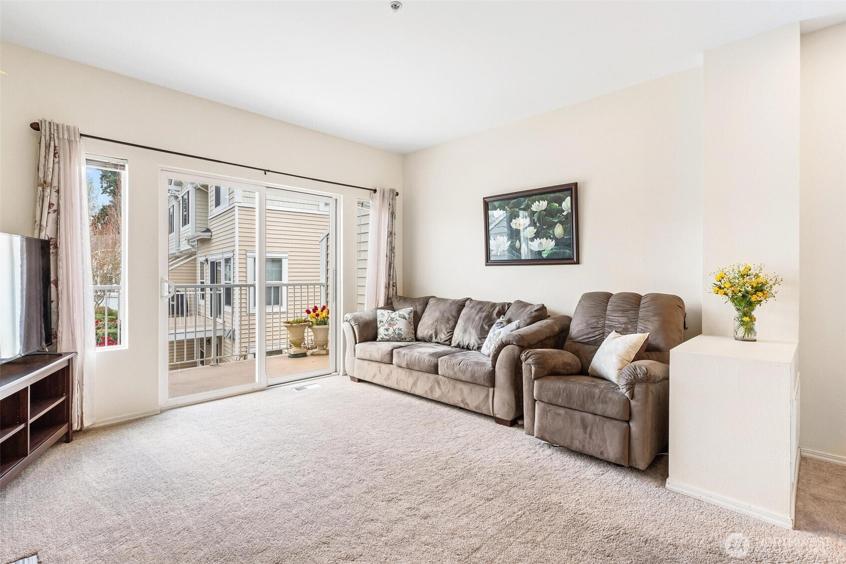 11856 Northeast 162nd Lane, Unit 94 Bothell, WA 98011 - Photo 5 of 36 a living room with furniture and a flat screen tv