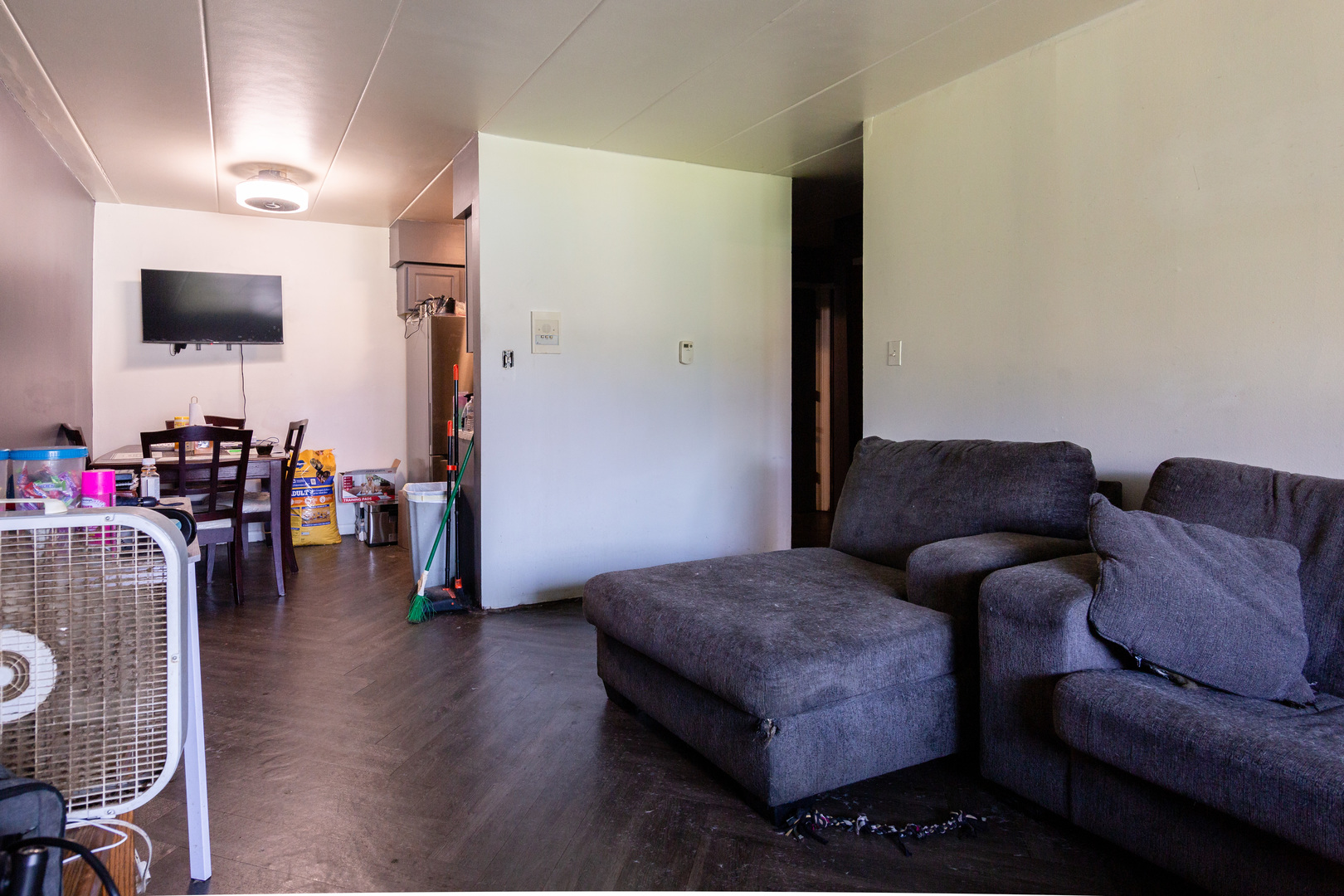 2340 186th Street, Unit 7 Lansing, IL 60438 - Photo 4 of 10 a living room with furniture and a flat screen tv