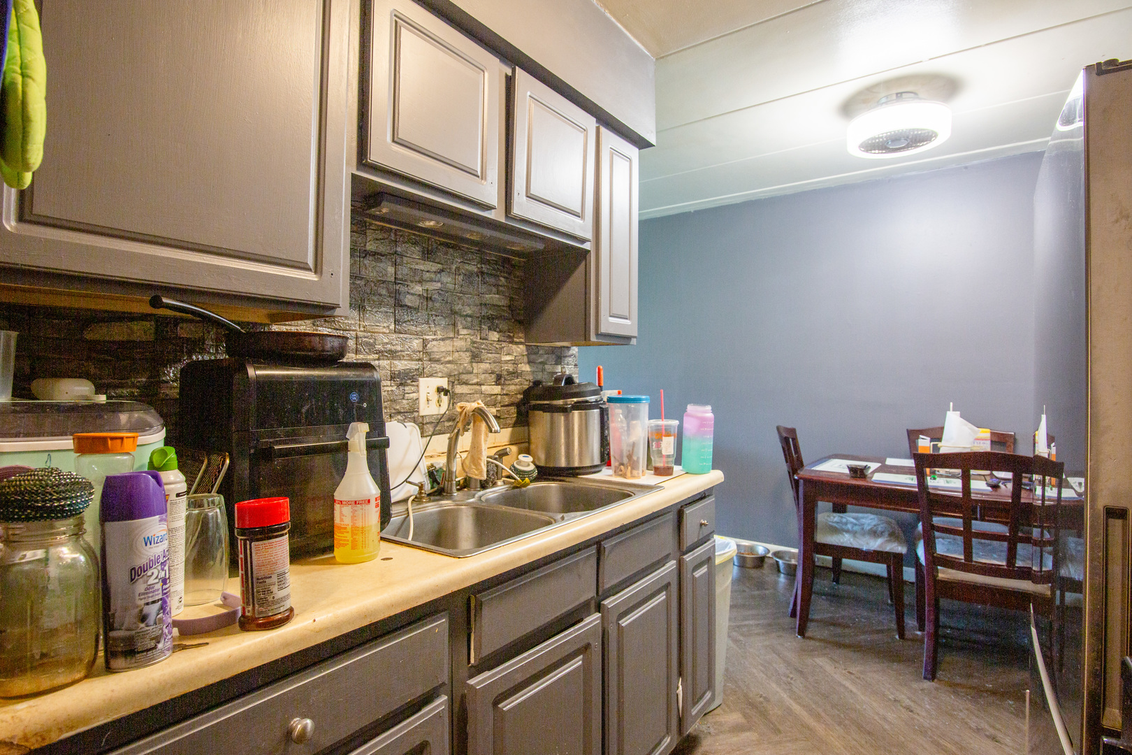 2340 186th Street, Unit 7 Lansing, IL 60438 - Photo 7 of 10 a kitchen with a sink cabinets and appliances