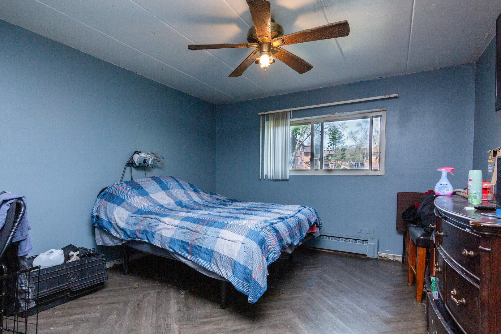 2340 186th Street, Unit 7 Lansing, IL 60438 - Photo 8 of 10 a bedroom with a bed and a chandelier