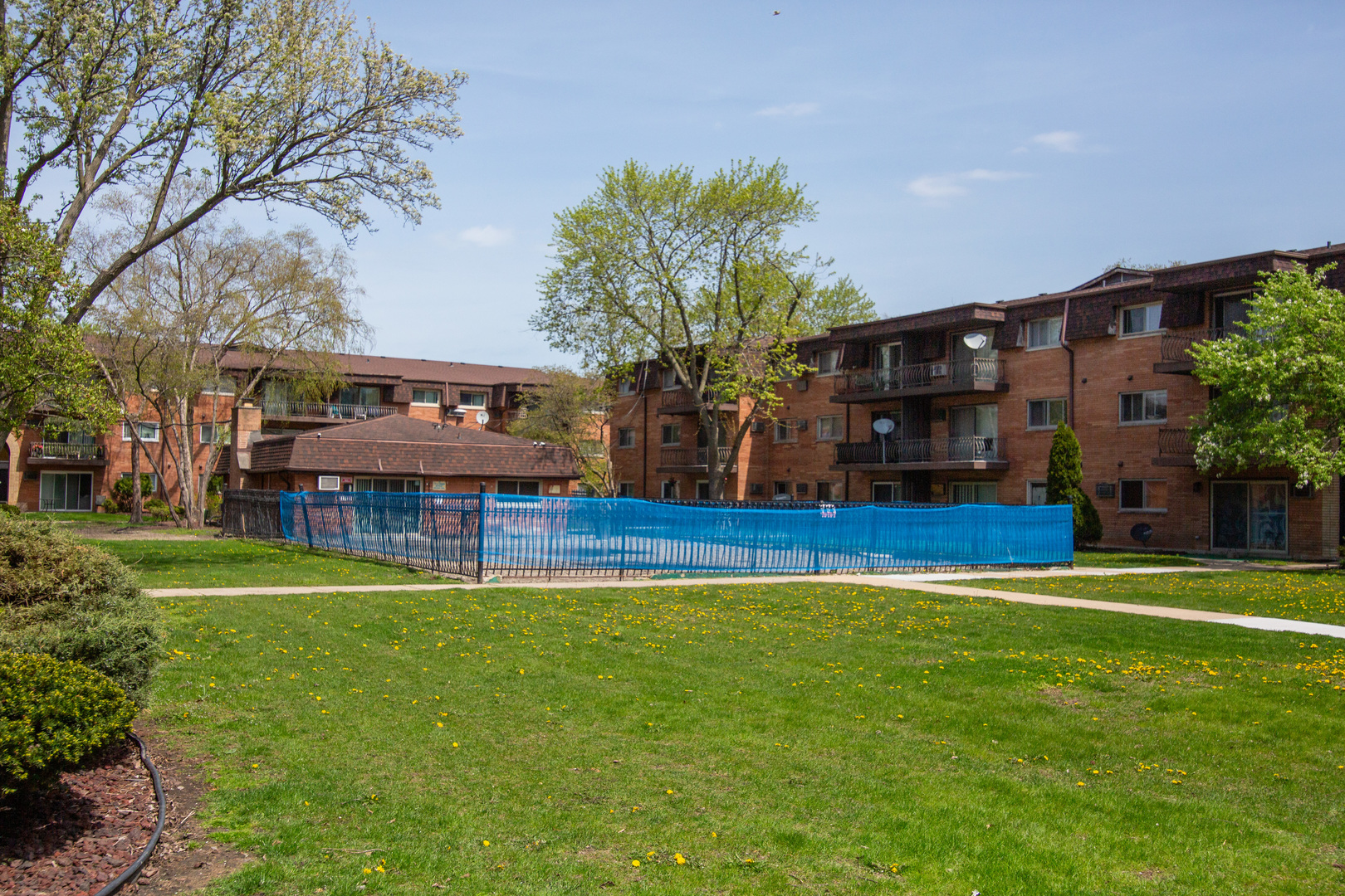 2340 186th Street, Unit 7 Lansing, IL 60438 - Photo 10 of 10 a house view with a sitting space and garden