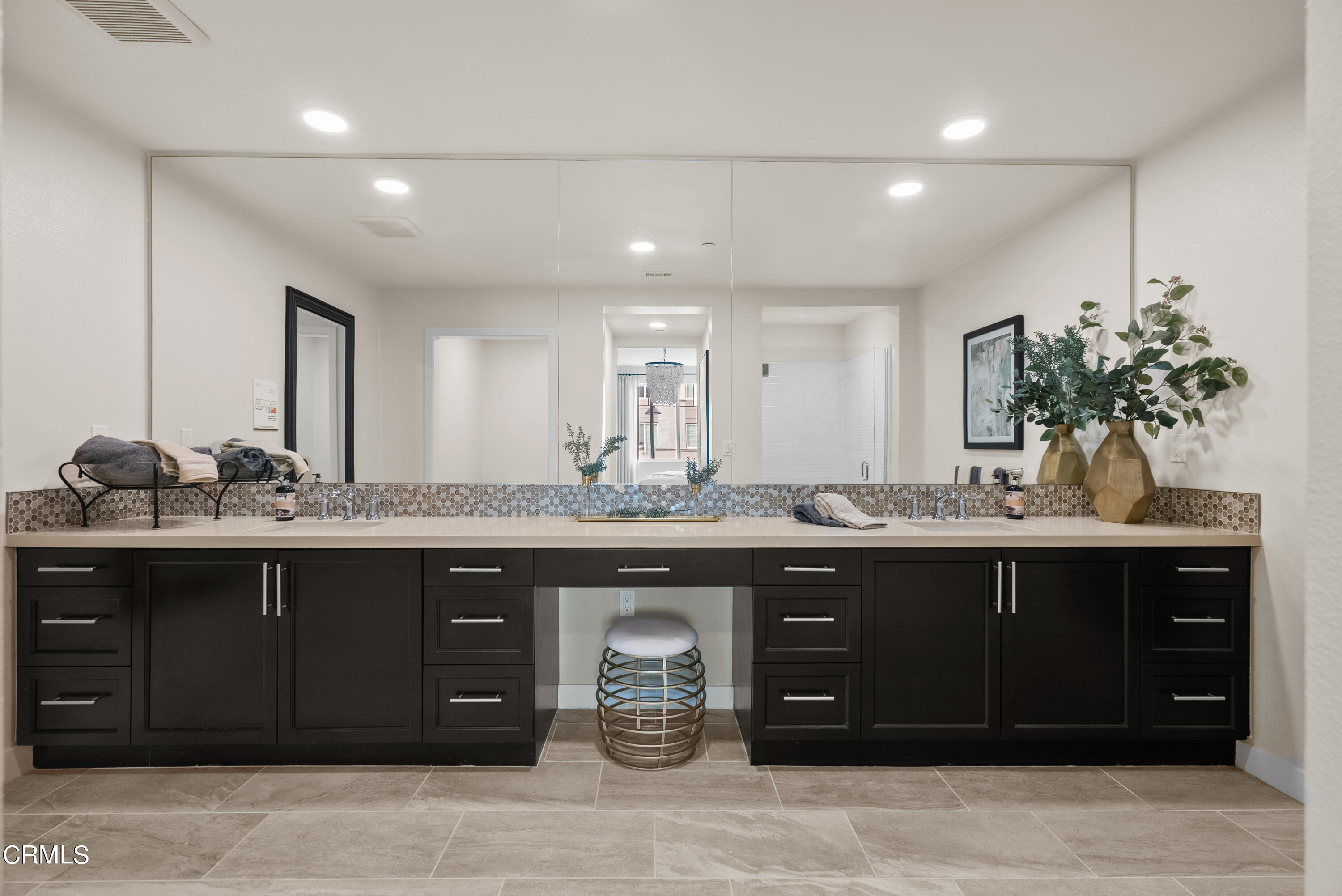 2840 Wagon Wheel Road, Unit 303 Oxnard, CA 93036 - Photo 24 of 26 a spacious bathroom with a granite countertop sink and a mirror