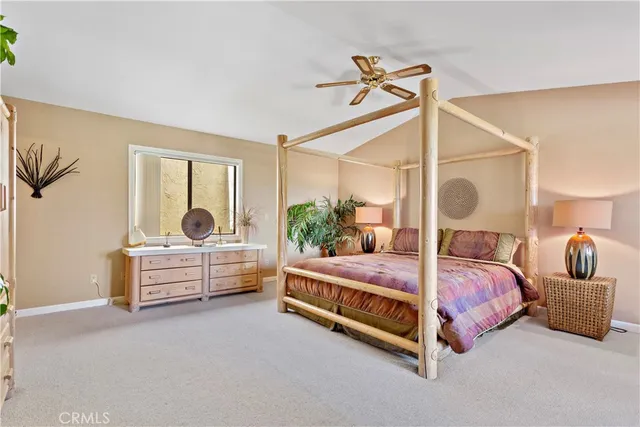 a bedroom with bed and window