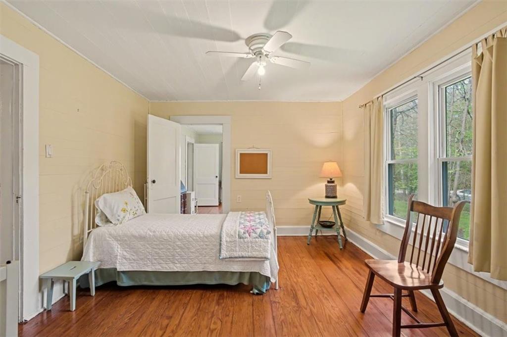 115 Price Street Bremen, GA 30110 - Photo 5 of 11 a bedroom with a bed and wooden floor