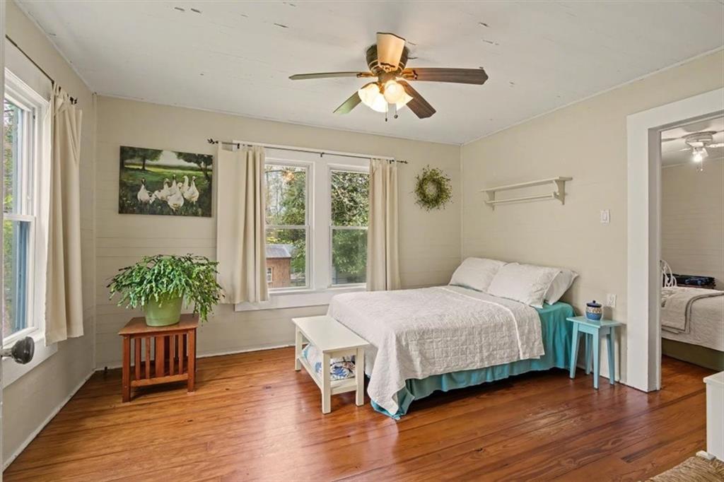 115 Price Street Bremen, GA 30110 - Photo 6 of 11 a bedroom with a bed and wooden floor