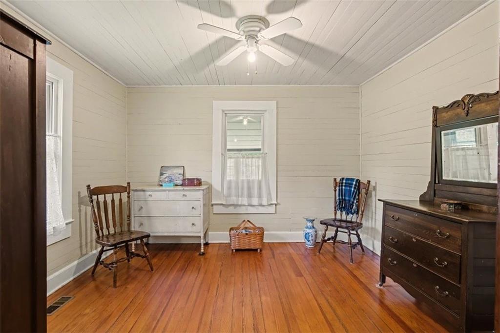 115 Price Street Bremen, GA 30110 - Photo 7 of 11 a workspace with furniture window and wooden floor