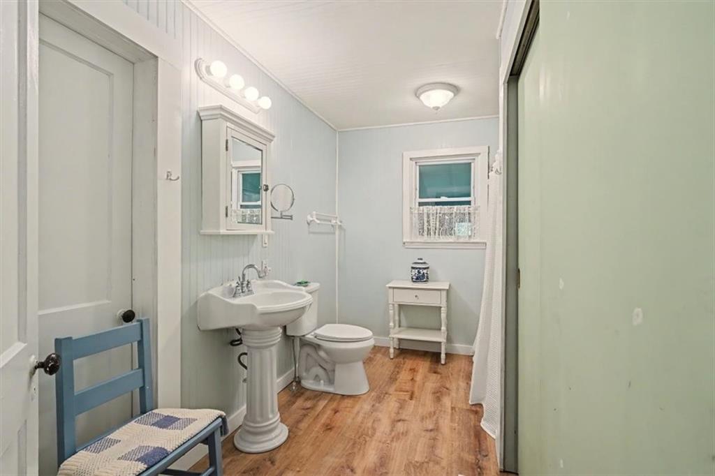 115 Price Street Bremen, GA 30110 - Photo 8 of 11 a bathroom with a toilet sink and a mirror