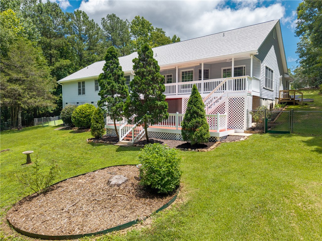 429 Burns Mill Road West Union, SC 29696 - Photo 47 of 49 A classic facade with a spacious deck and generous yard, ideal for outdoor living.