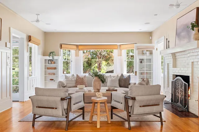 a dining room with wooden floor and a rug