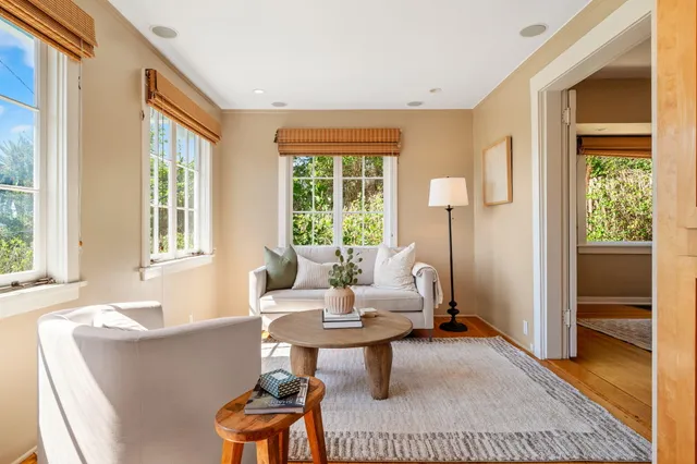 a view of a livingroom with furniture and a window