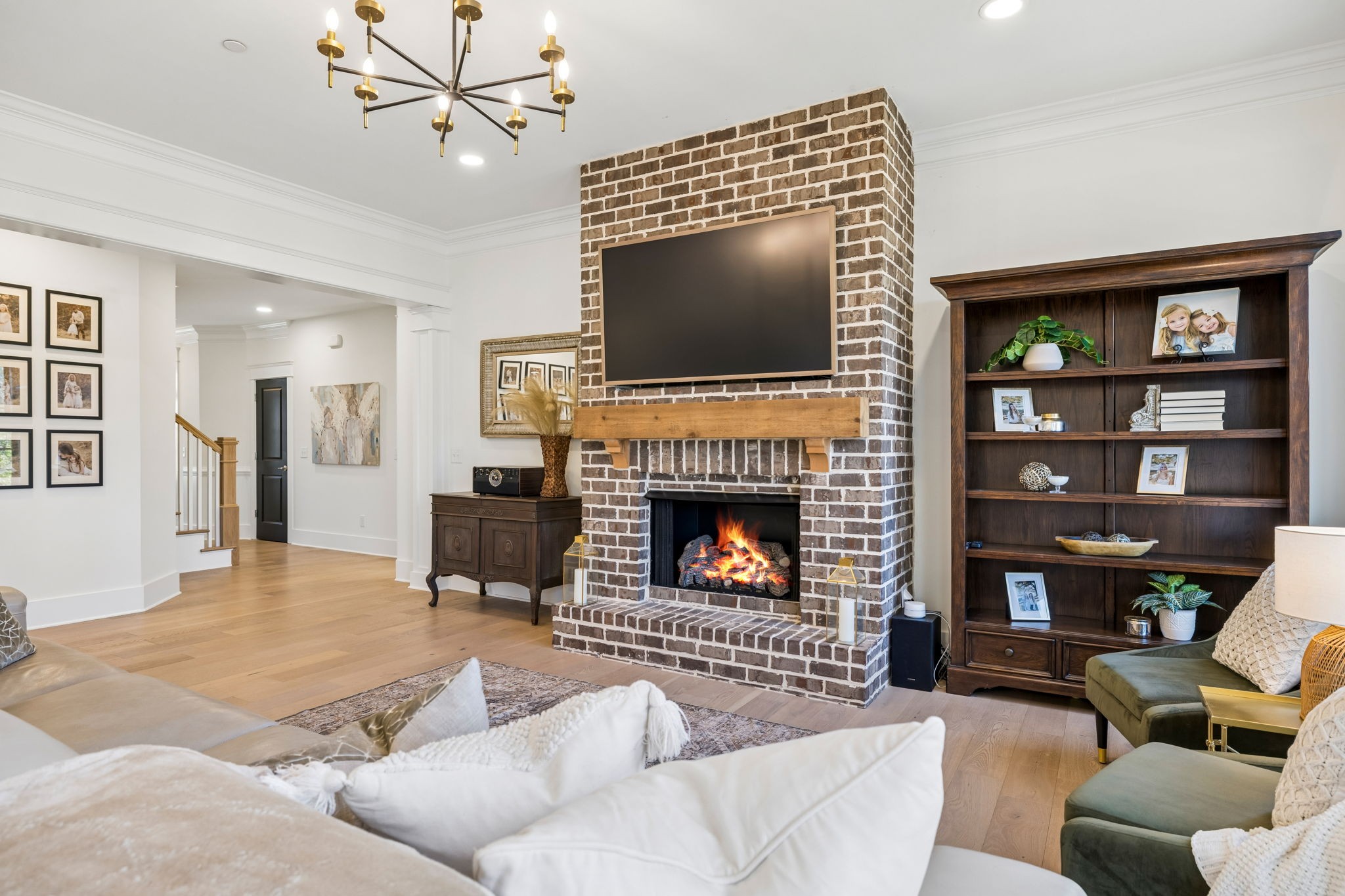 119 Stream Valley Boulevard Franklin, TN 37064 - Photo 24 of 100 a living room with furniture a flat screen tv and a fireplace