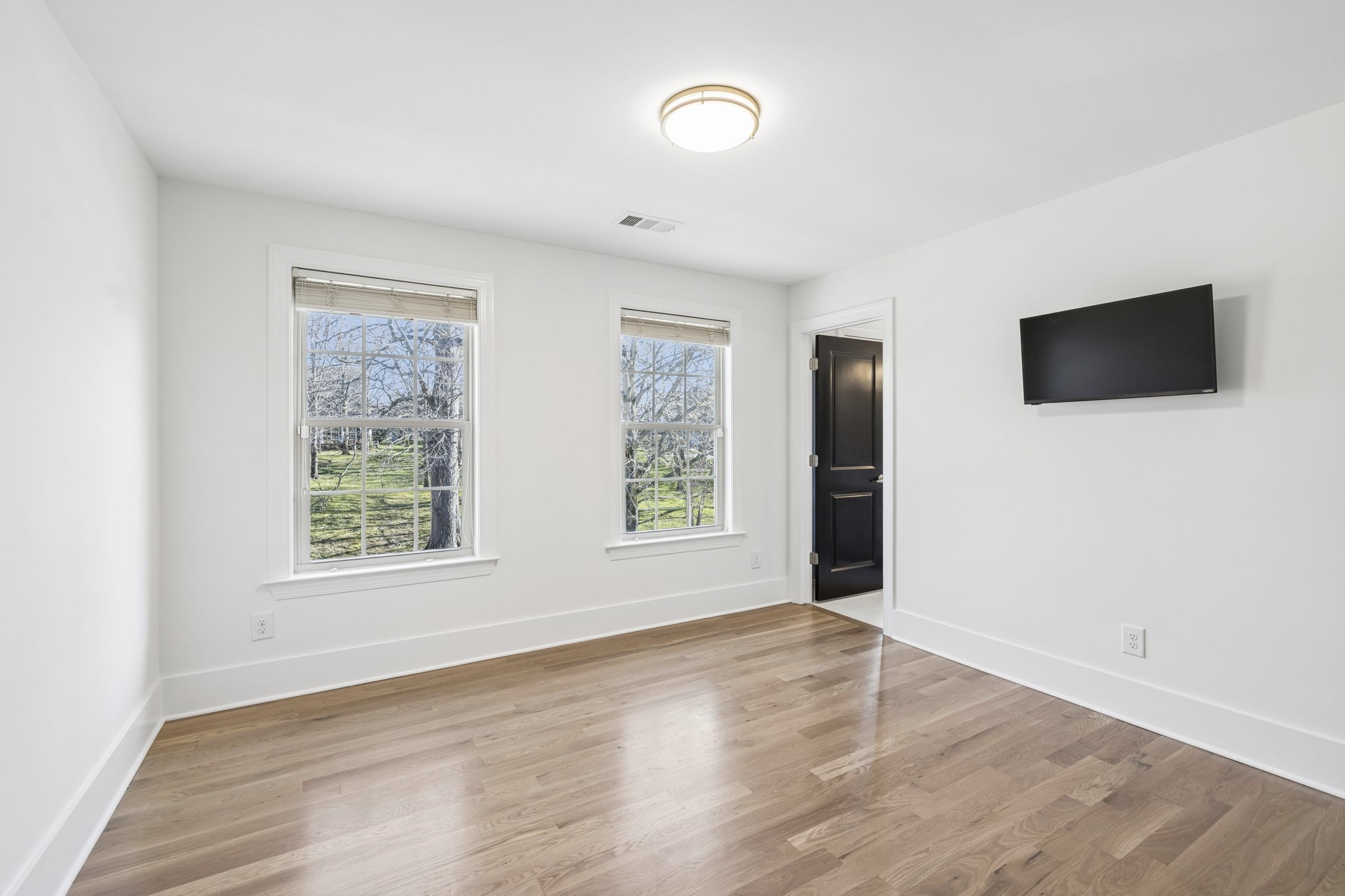 119 Stream Valley Boulevard Franklin, TN 37064 - Photo 54 of 100 an empty room with wooden floor and windows