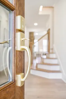 a view of a dining room and hall with wooden floor
