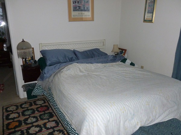19 Chapel Street Warren, MA 01092 - Photo 16 of 30 a bedroom with a bed and wooden floor