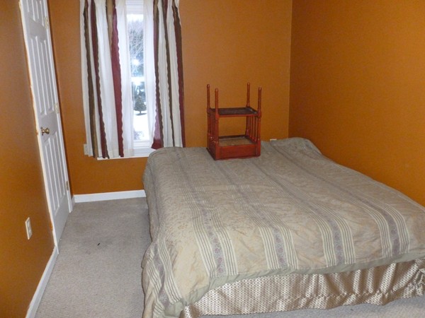 19 Chapel Street Warren, MA 01092 - Photo 19 of 30 a bedroom with a bed and a window