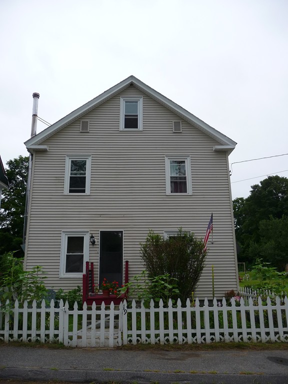 19 Chapel Street Warren, MA 01092 - Photo 2 of 30 a front view of house with yard and green space