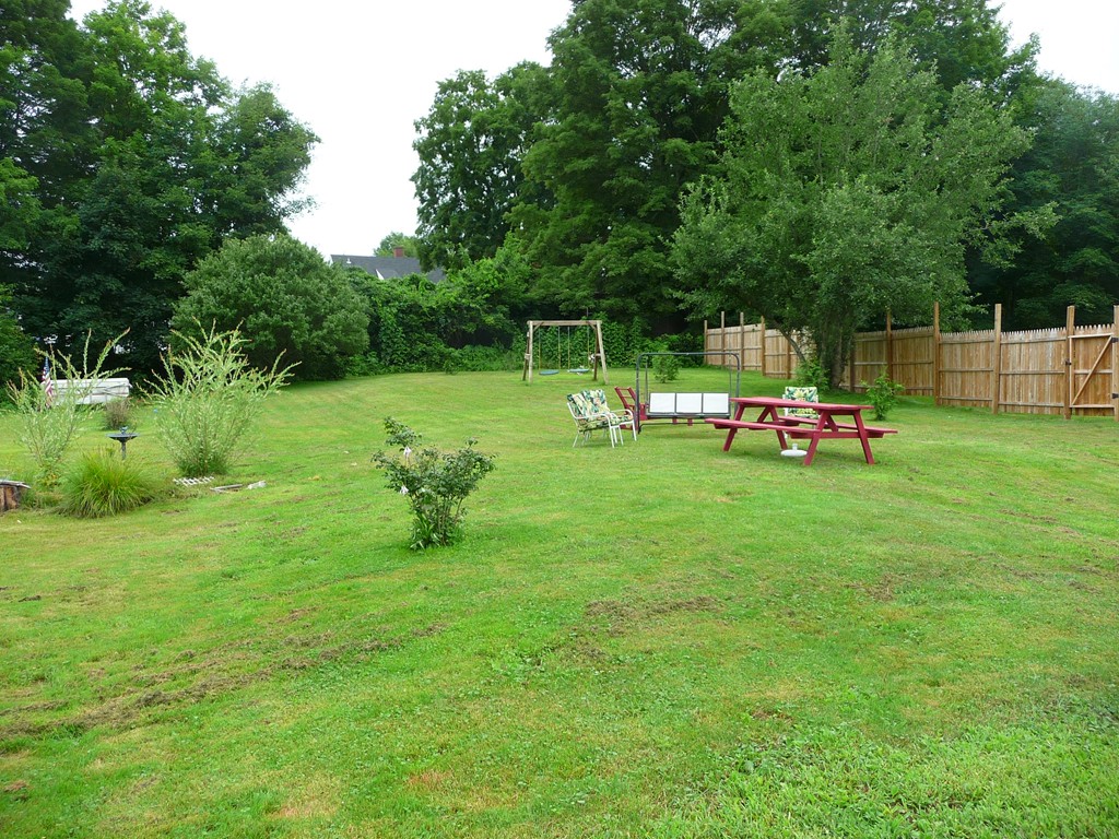 19 Chapel Street Warren, MA 01092 - Photo 24 of 30 a view of a park with large trees and couches
