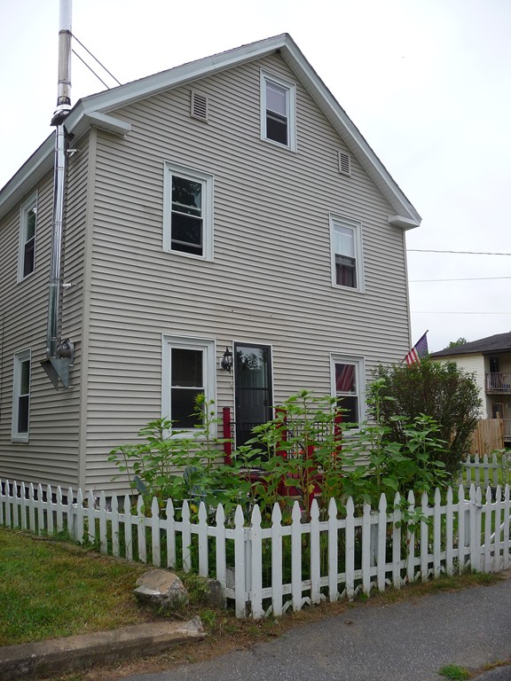 19 Chapel Street Warren, MA 01092 - Photo 30 of 30 a front view of a house with a garden