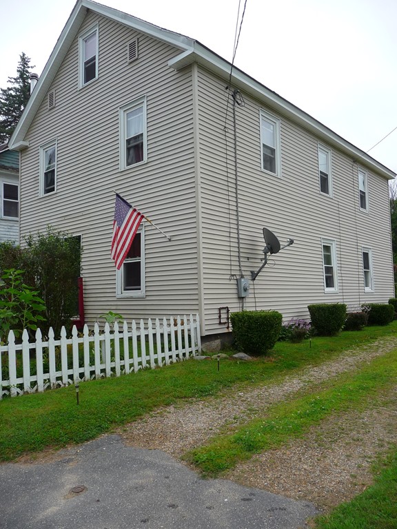 19 Chapel Street Warren, MA 01092 - Photo 3 of 30 a front view of a house with a yard