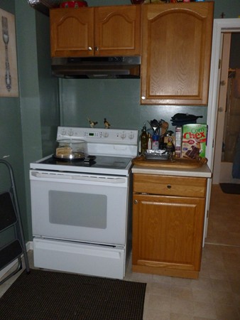 19 Chapel Street Warren, MA 01092 - Photo 5 of 30 a stove top oven sitting inside of a kitchen