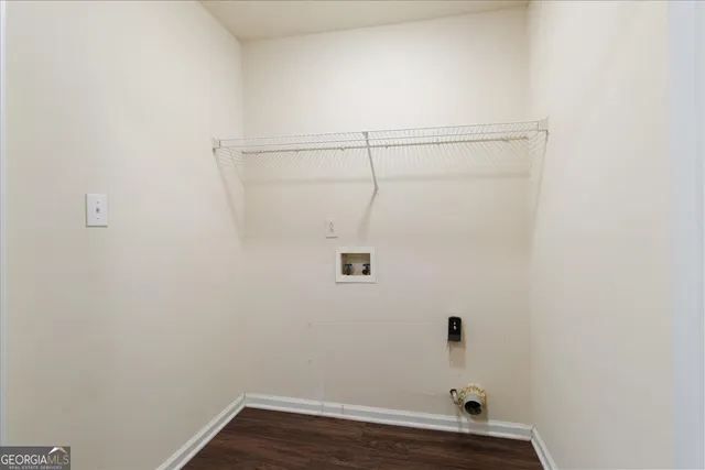 a bathroom with a toilet and a window