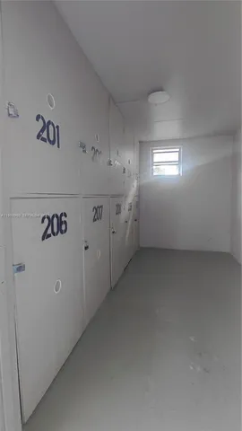 a view of a kitchen with furniture and a flat screen tv