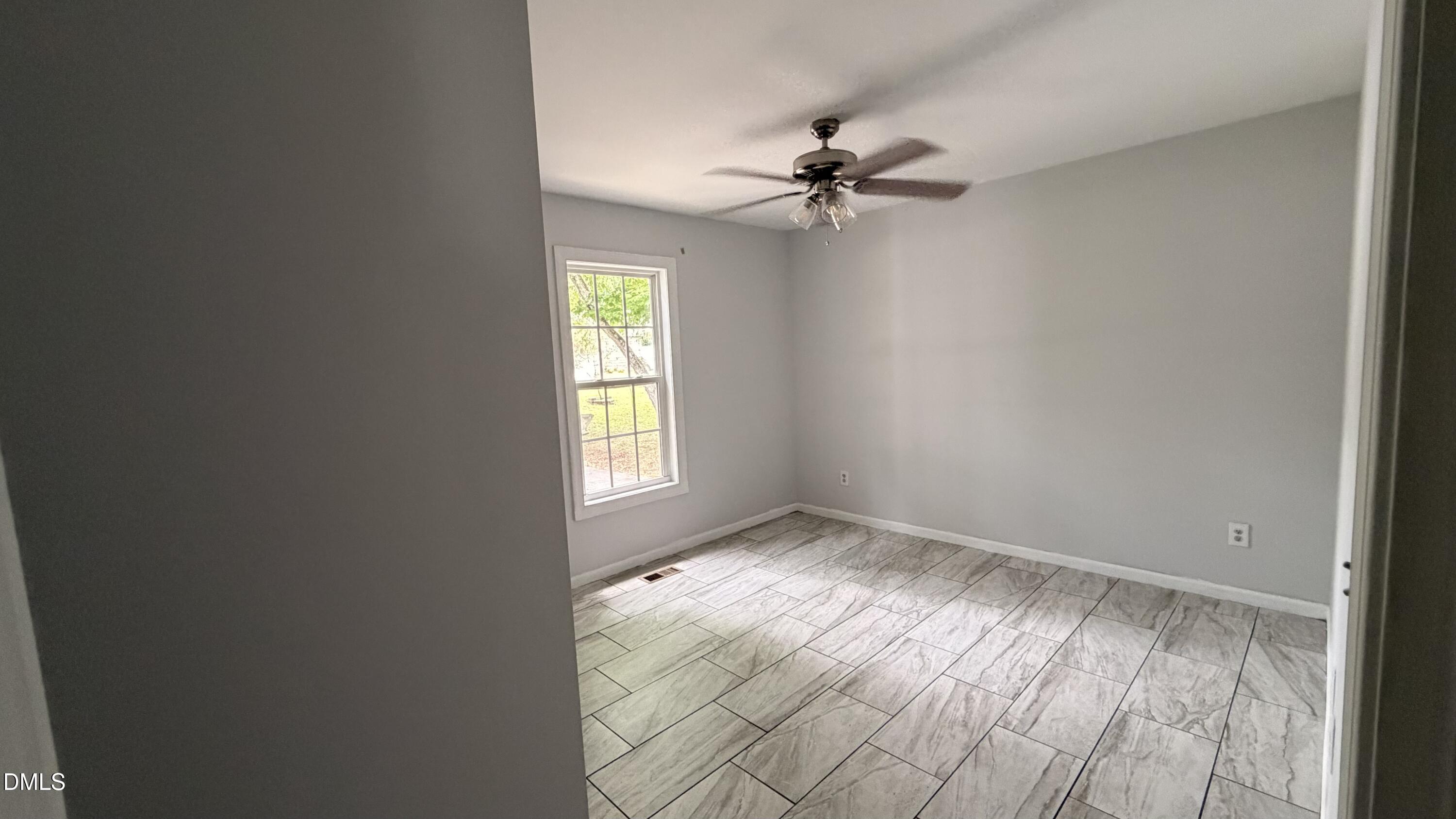 229 Sterling Way Angier, NC 27501 - Photo 3 of 10 a view of empty room with window