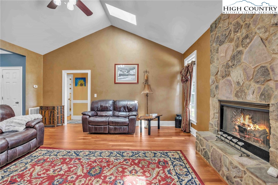 127 Deerfield Road West Jefferson, NC 28694 - Photo 11 of 47 a living room with furniture and a fireplace