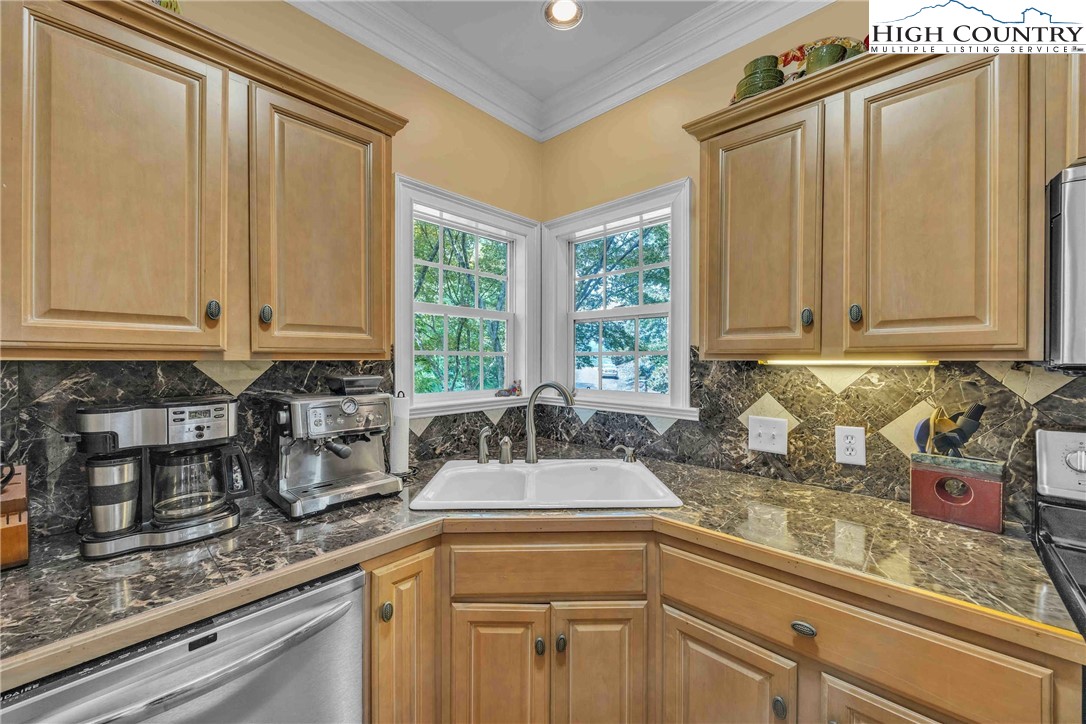 127 Deerfield Road West Jefferson, NC 28694 - Photo 17 of 47 a kitchen with sink cabinets and window