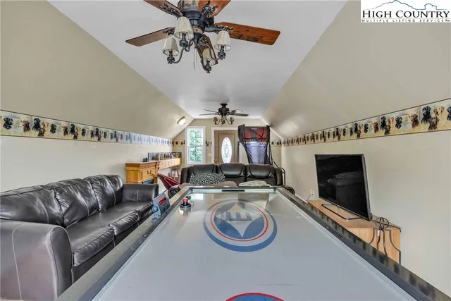 an aerial view of a house with outdoor space and street view