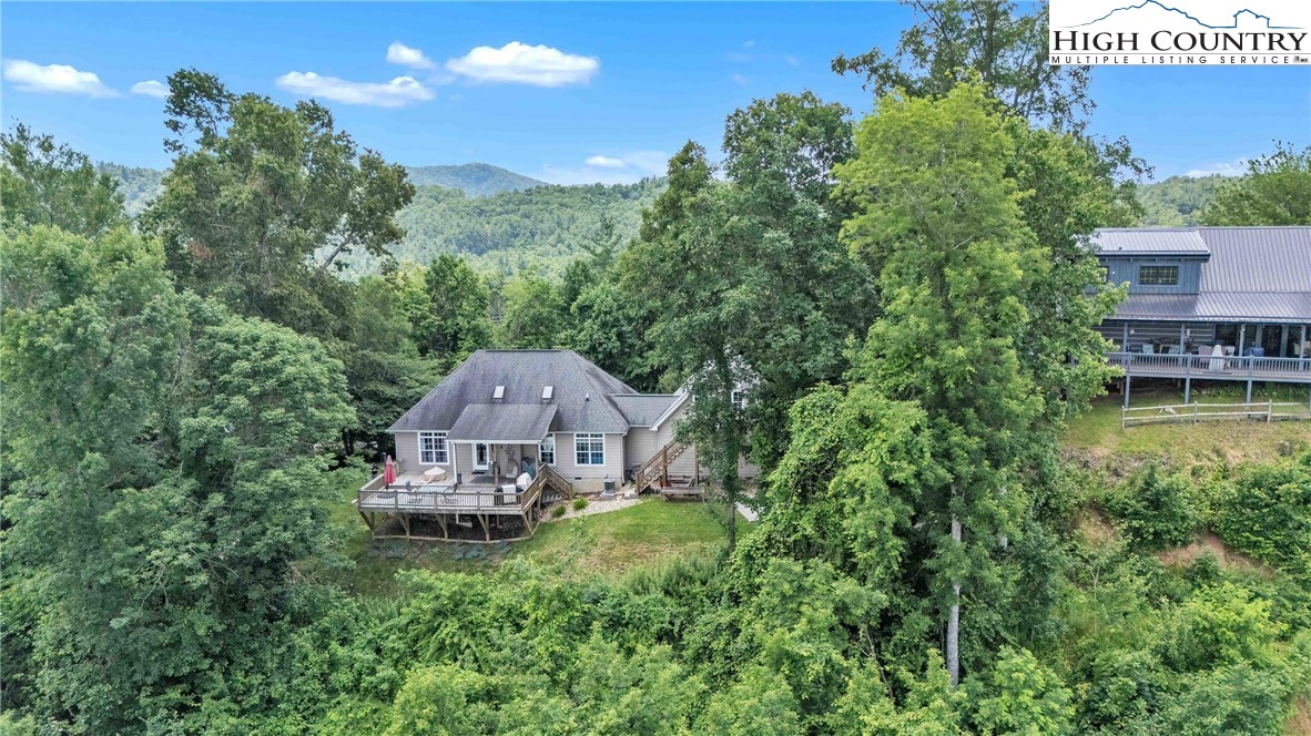 127 Deerfield Road West Jefferson, NC 28694 - Photo 42 of 47 an aerial view of a house with a garden and a yard