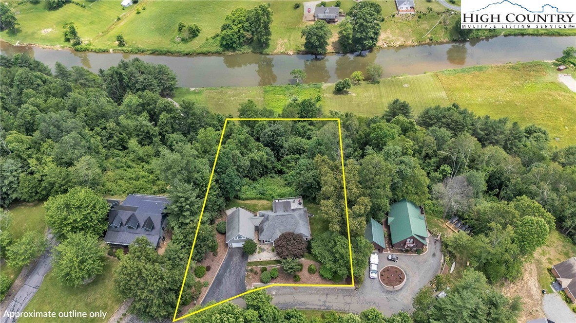 127 Deerfield Road West Jefferson, NC 28694 - Photo 46 of 47 an aerial view of a house with a yard and lake view