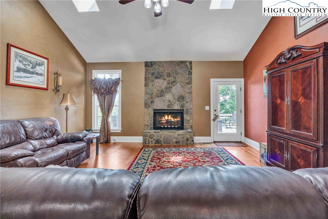 127 Deerfield Road West Jefferson, NC 28694 - Photo 8 of 47 a living room with furniture and a fireplace