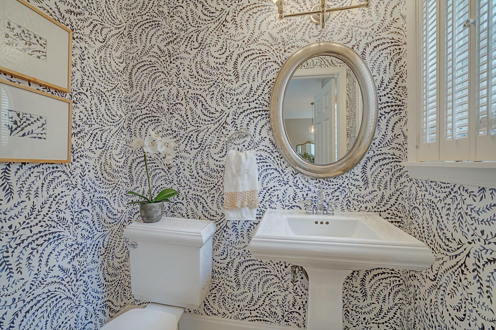 5961 Catesby Street Boca Raton, FL 33433 - Photo 12 of 41 a bathroom with a sink and mirror with toilet