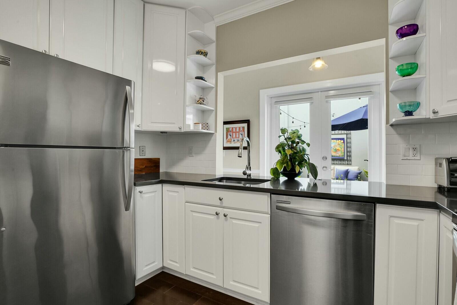 5961 Catesby Street Boca Raton, FL 33433 - Photo 14 of 41 a kitchen with a refrigerator and a sink