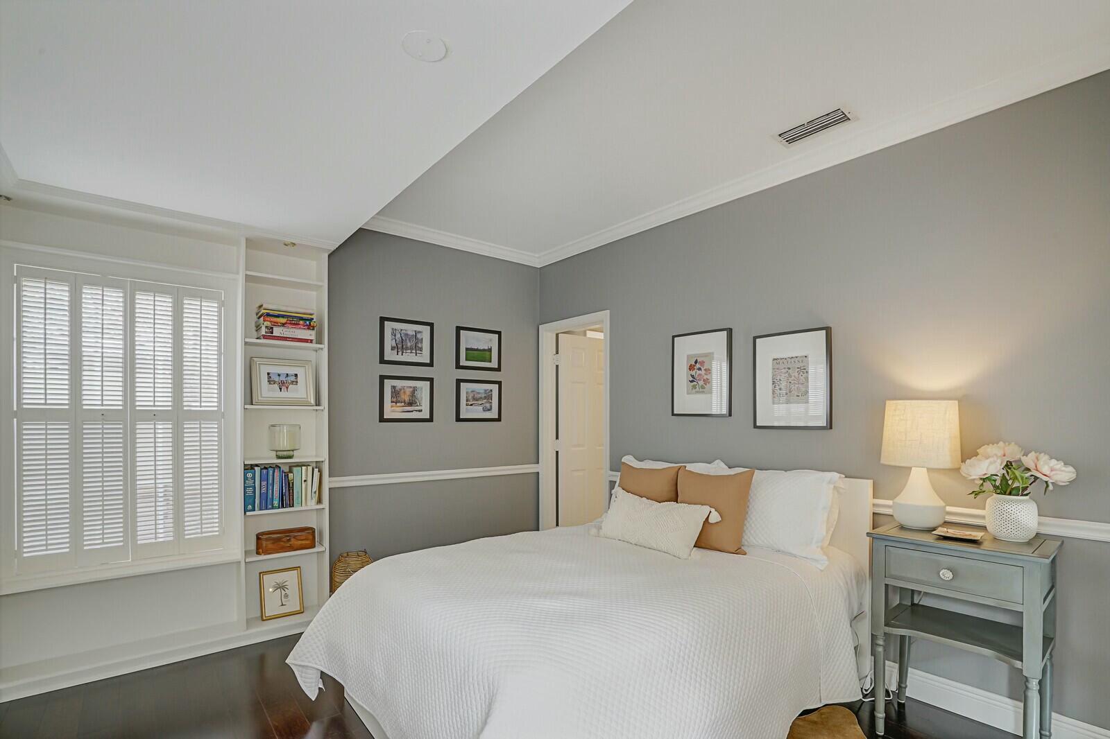 5961 Catesby Street Boca Raton, FL 33433 - Photo 16 of 41 a bedroom with a large bed and a window