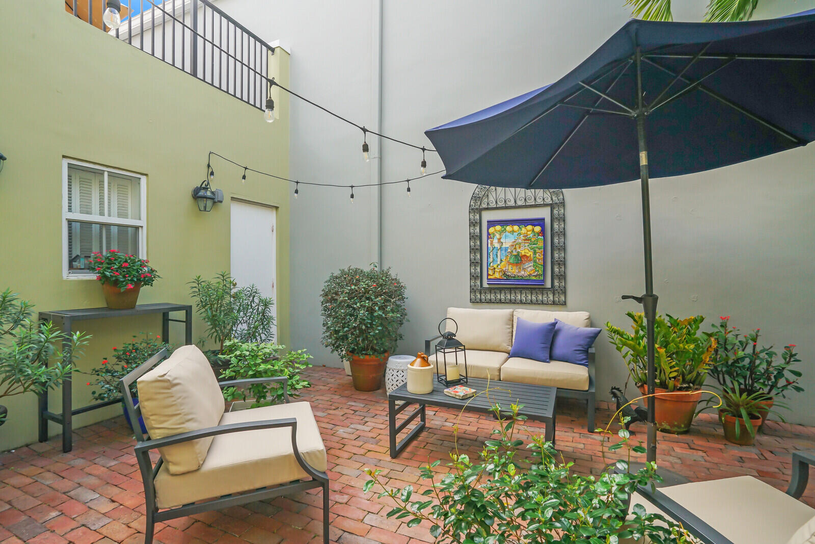 5961 Catesby Street Boca Raton, FL 33433 - Photo 21 of 41 a patio with a patio table and chairs