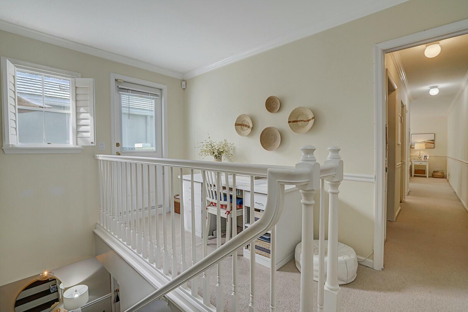 5961 Catesby Street Boca Raton, FL 33433 - Photo 24 of 41 a view of a hallway to a livingroom with wooden floor and windows