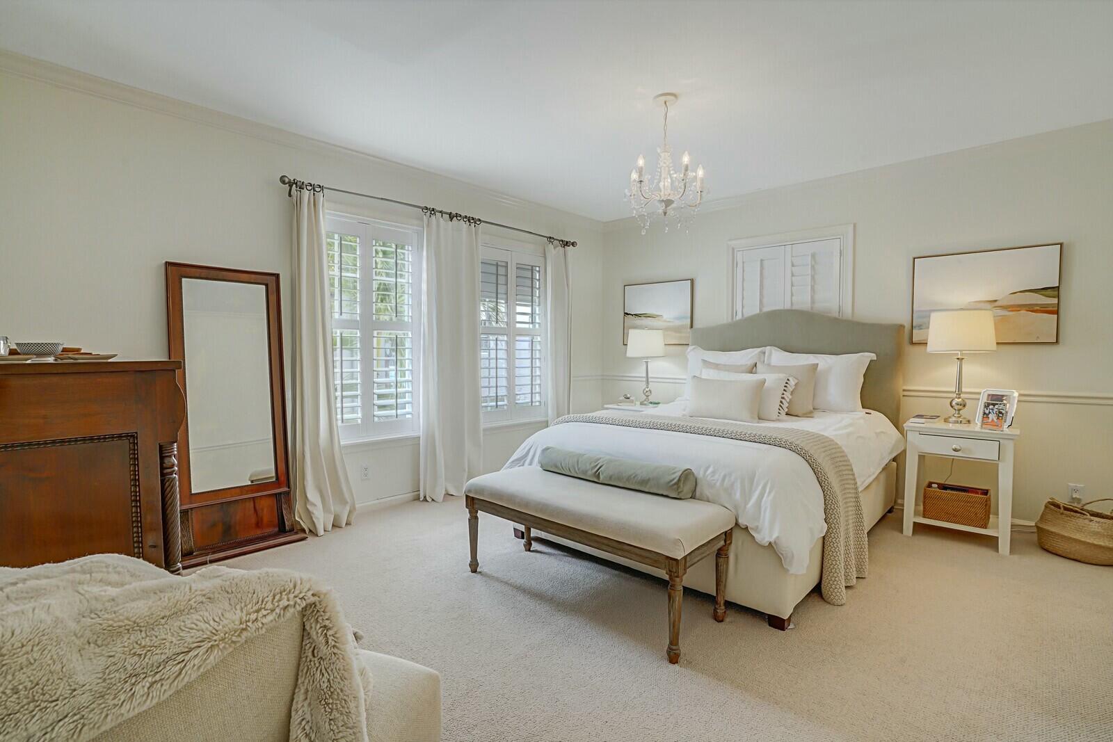 5961 Catesby Street Boca Raton, FL 33433 - Photo 27 of 41 a spacious bedroom with a bed and a couch