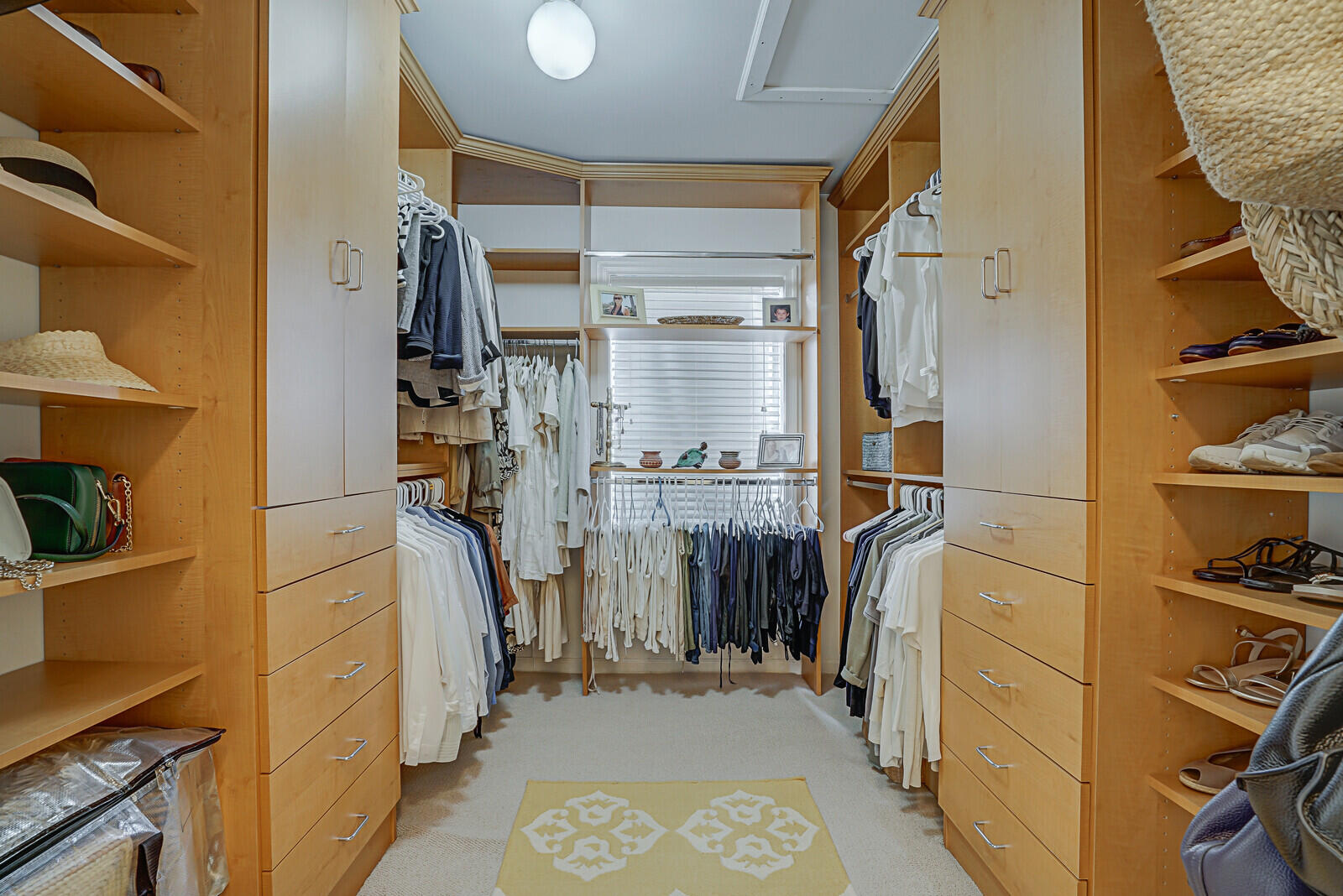 5961 Catesby Street Boca Raton, FL 33433 - Photo 28 of 41 a view of walk in closet with clothes and shoes