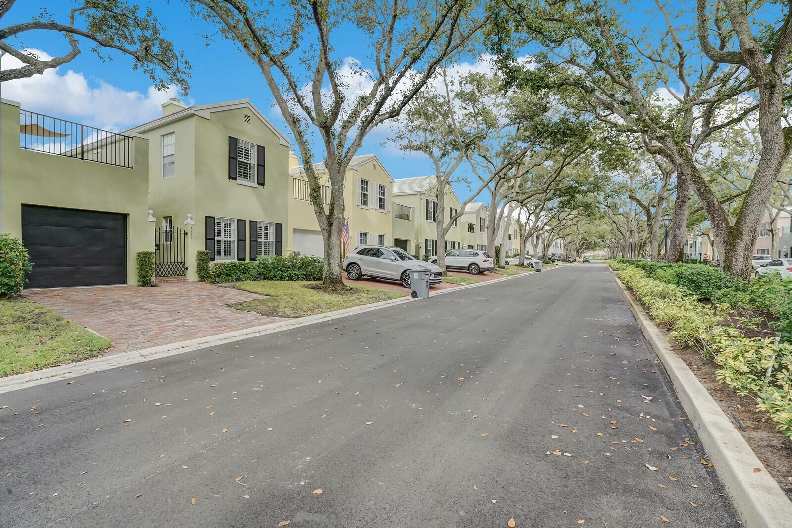 5961 Catesby Street Boca Raton, FL 33433 - Photo 36 of 41 a view of a white house with a large trees