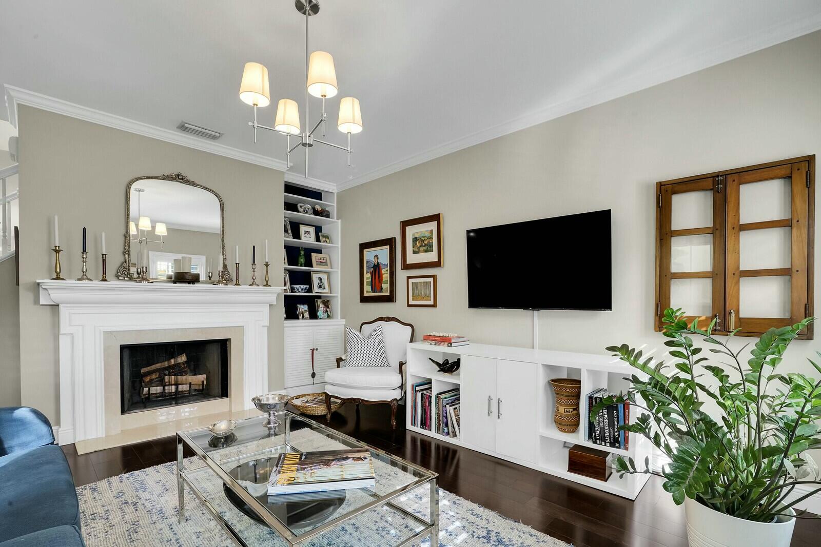 5961 Catesby Street Boca Raton, FL 33433 - Photo 7 of 41 a living room with furniture a fireplace and a flat screen tv