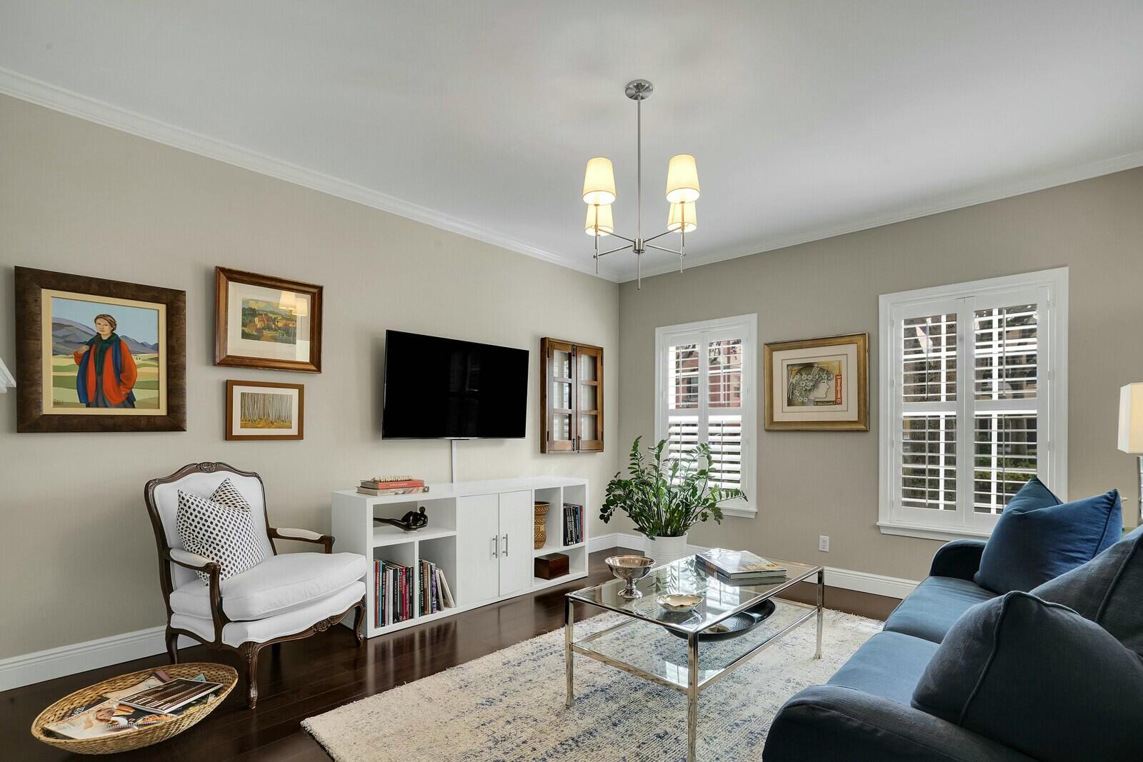 5961 Catesby Street Boca Raton, FL 33433 - Photo 8 of 41 a living room with furniture a large window and a flat screen tv