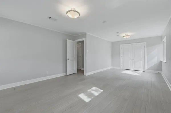 a view of green field with tree in the background