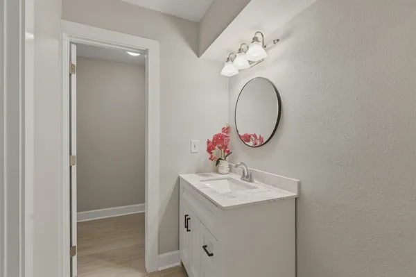 an aerial view of a house with a yard basket ball court and outdoor seating