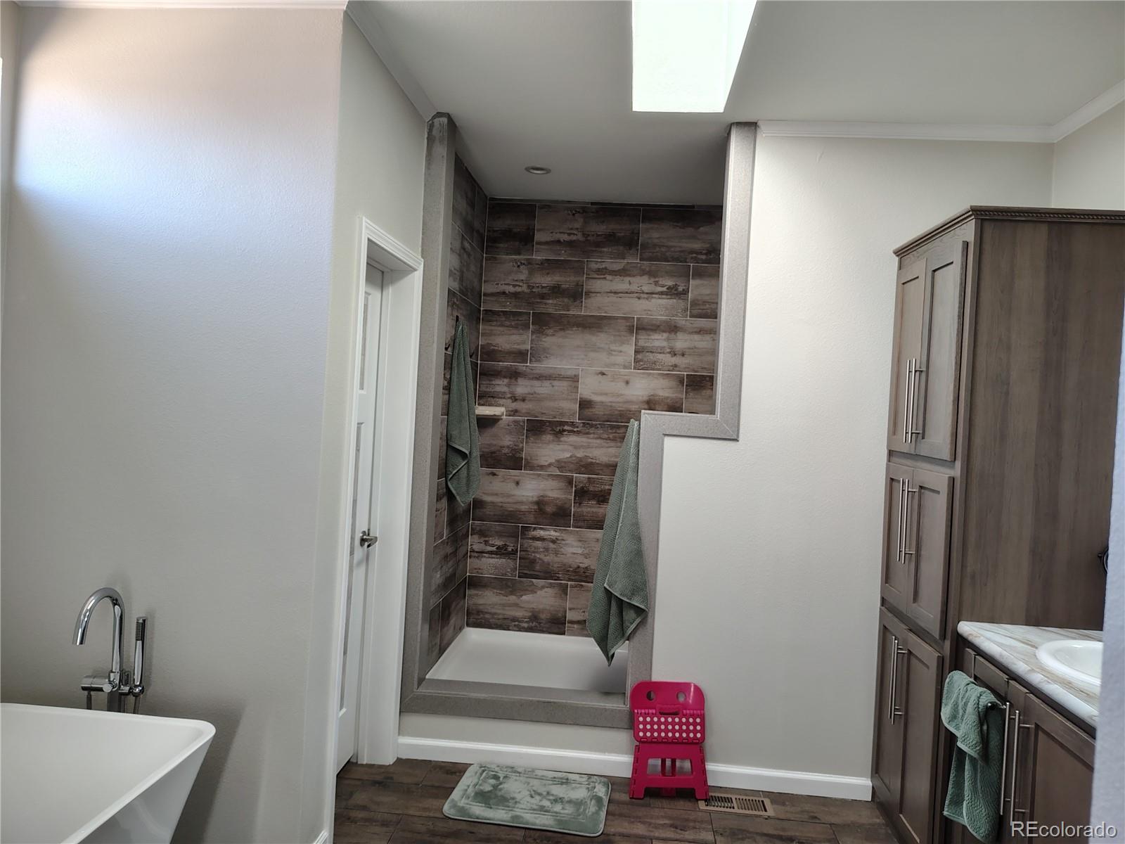 15460 Casler Avenue Fort Lupton, CO 80621 - Photo 11 of 13 a bathroom with a shower
