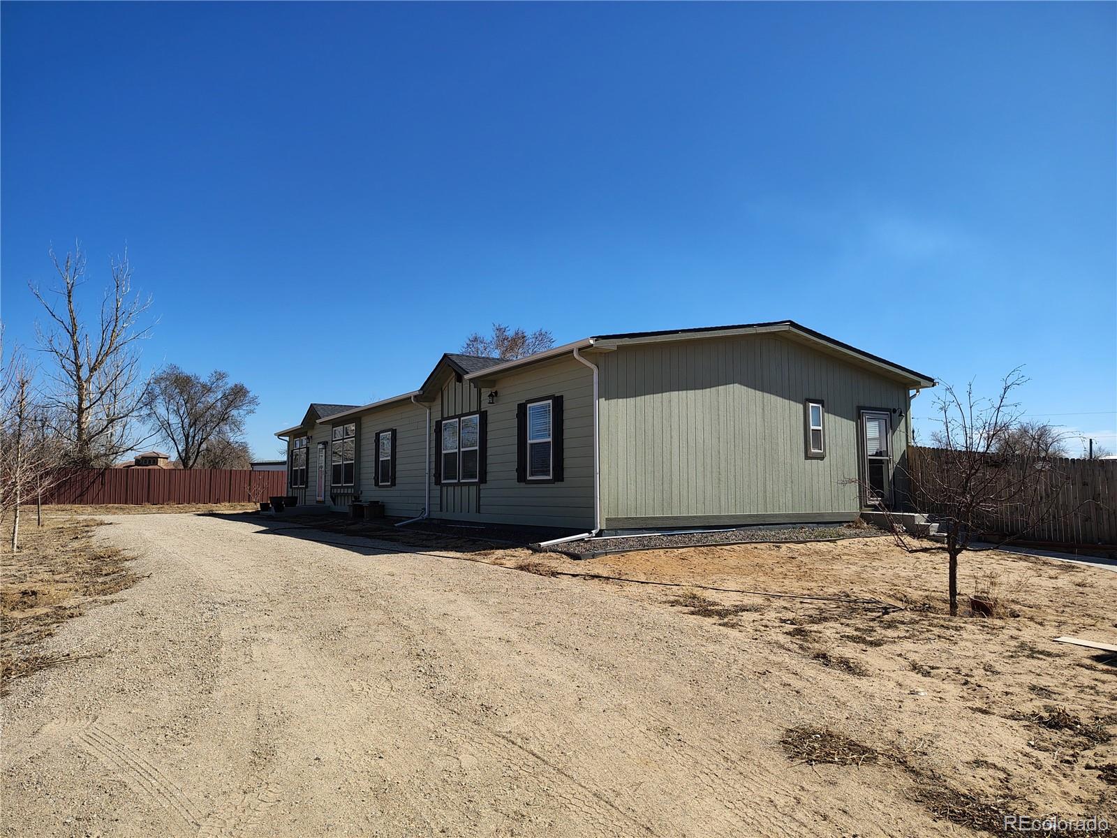 15460 Casler Avenue Fort Lupton, CO 80621 - Photo 2 of 13 a house with a outdoor space